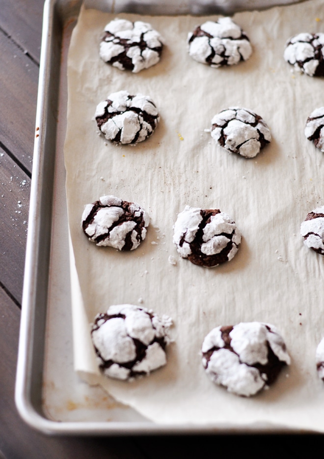 Baked snowball cookies on the baking sheet.