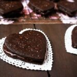 Valentine's Day Heart Sandwich cookies on a doily.