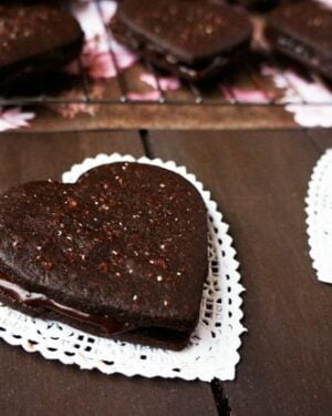 Valentine's Day Heart Sandwich cookies on a doily.