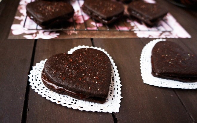 Valentine's Day Heart Sandwich cookies on a doily.