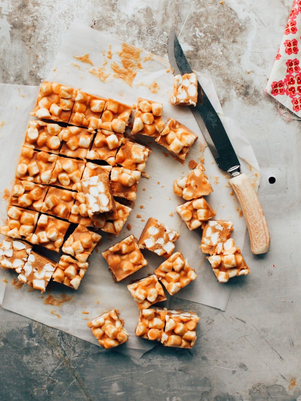 peanut butter marshmallow bars cut into squares on a sheet