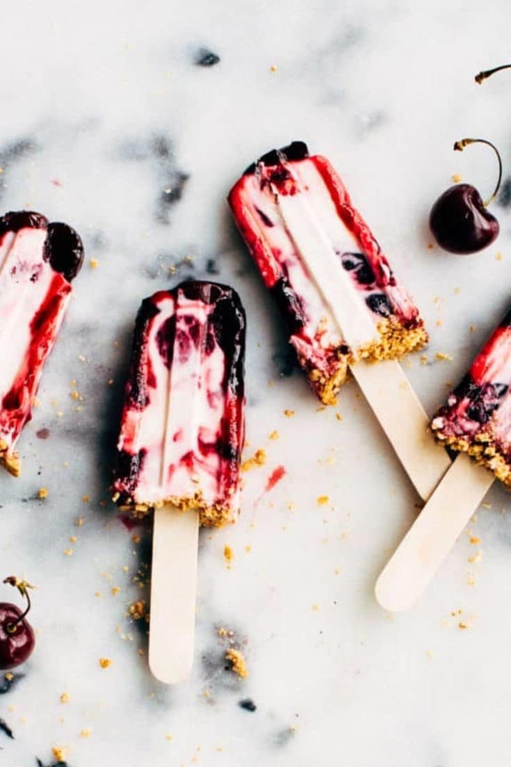 Say goodbye to your classic frozen treats and try out this amazing homemade Cherry Cheesecake Popsicle Recipe with fresh fruity compote and graham cracker crumbs! No ice cream or ice pop can compare to this sweet treat. Find out how you can make this simple recipe today!