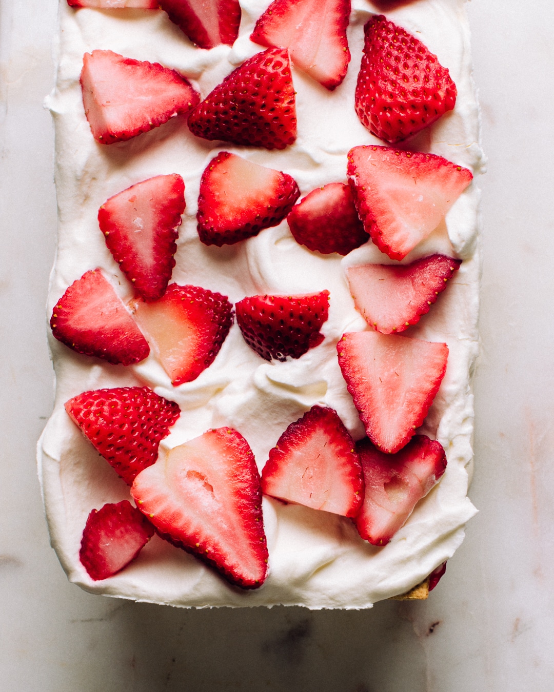 A whole strawberry icebox cake before slicing.