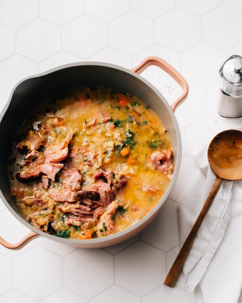 This Lentil Soup with Ham Recipe is a simple, comforting, healthy and mostly-hands-off recipe.  It features hearty lentils, tender vegetables and fall-apart-tender ham. You can let it simmer away on the stovetop, or make it in 30 minutes in a pressure cooker.