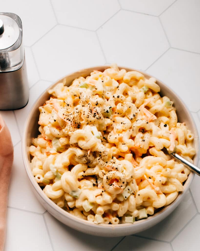 A classic macaroni salad recipe is simple & easy with a creamy dressing and the perfect ratio of crunchy toppings to soft macaroni noodles.