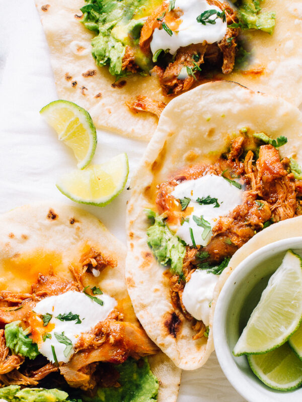 Chicken Tacos with Crockpot Taco Meat, guacamole and sour cream.