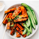 Try this mouth-watering chili garlic tofu recipe with an incredible sweet and spicy sauce for a healthy source of vegan protein. Whip it up in minutes and be blown away.