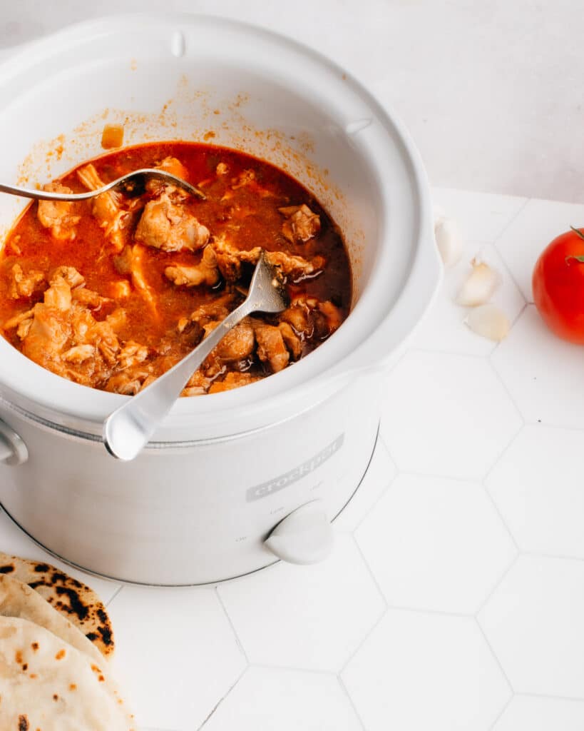 These easy Shredded (or pulled) Chicken Tacos are cooked in a crockpot with the best, crazy-delicious sauce. You don't want to miss my tips for the best way to shred chicken, plus a comprehensive list of yummy chicken taco toppings. A slow cooker makes this healthy recipe super simple and hands off. 