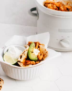 These easy shredded (or pulled) chicken tacos are cooked in a crockpot with a delicious sauce, and are perfect for any time of the year.