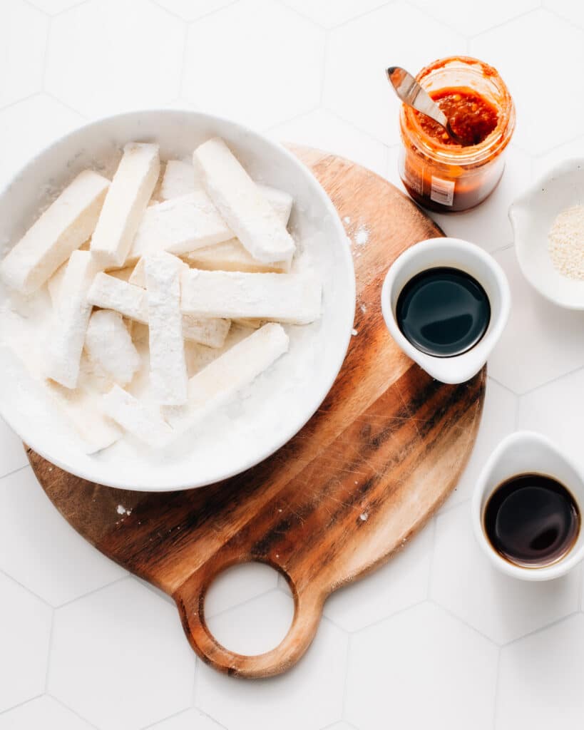 Chili Garlic Tofu with a sticky-sweet spicy sauce: a healthy, easy recipe with vegan protein + 3 boss tips for making crispy tofu every time. Plus, see my expert answer to whether or not you should marinate tofu.
