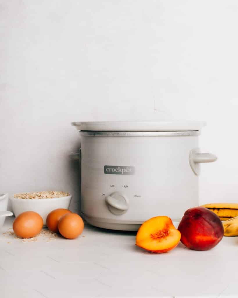 These Crockpot™ Slow Cooker Baked Oats are such an easy way to get breakfast on the table quickly in the morning. Made overnight, my version of this viral TikTok baked oatmeal recipe features juicy peaches. Feel free to swap in any other in-season fruit (or even chocolate chips!). 
