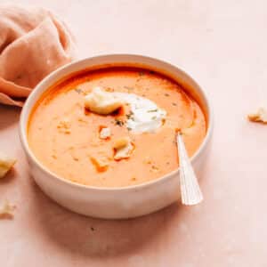 Homemade Tomato Soup in a bowl with cream and croutons