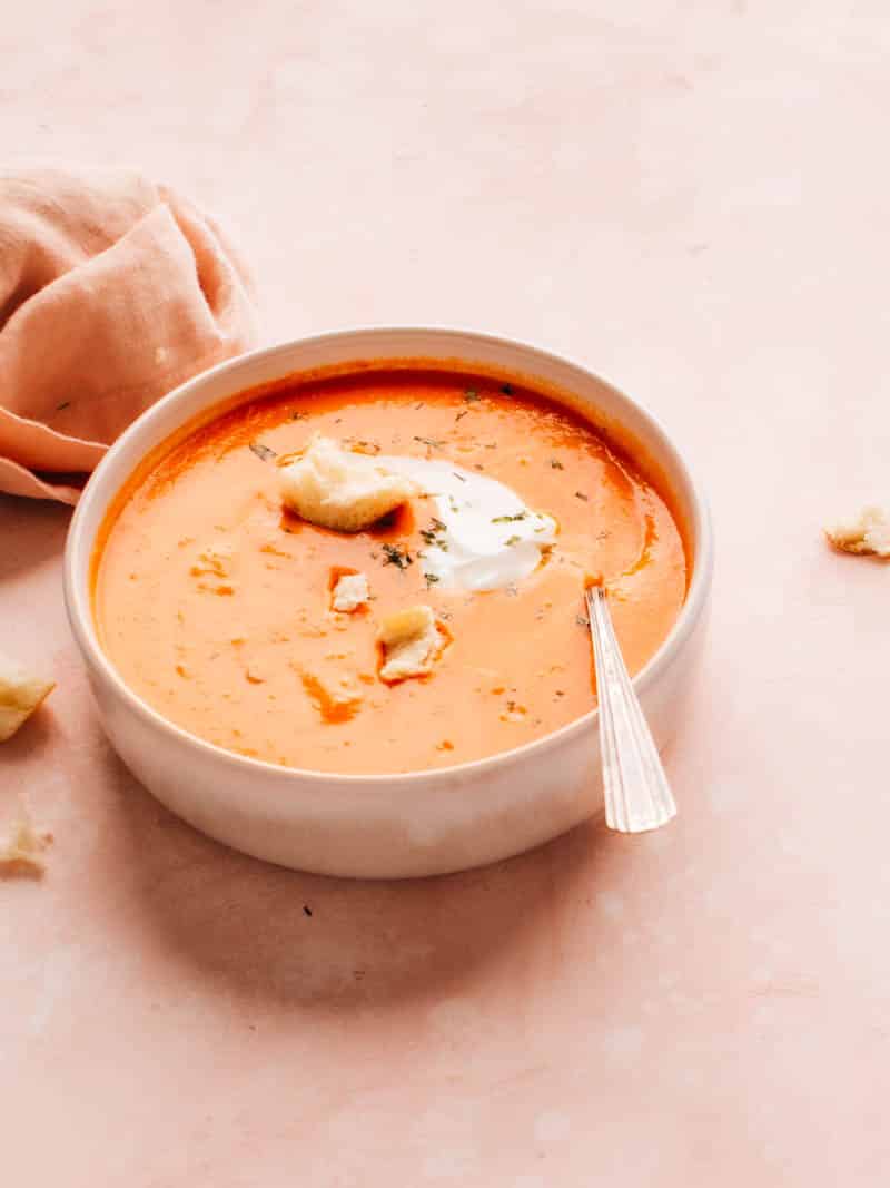 Homemade Tomato Soup in a bowl with cream and croutons