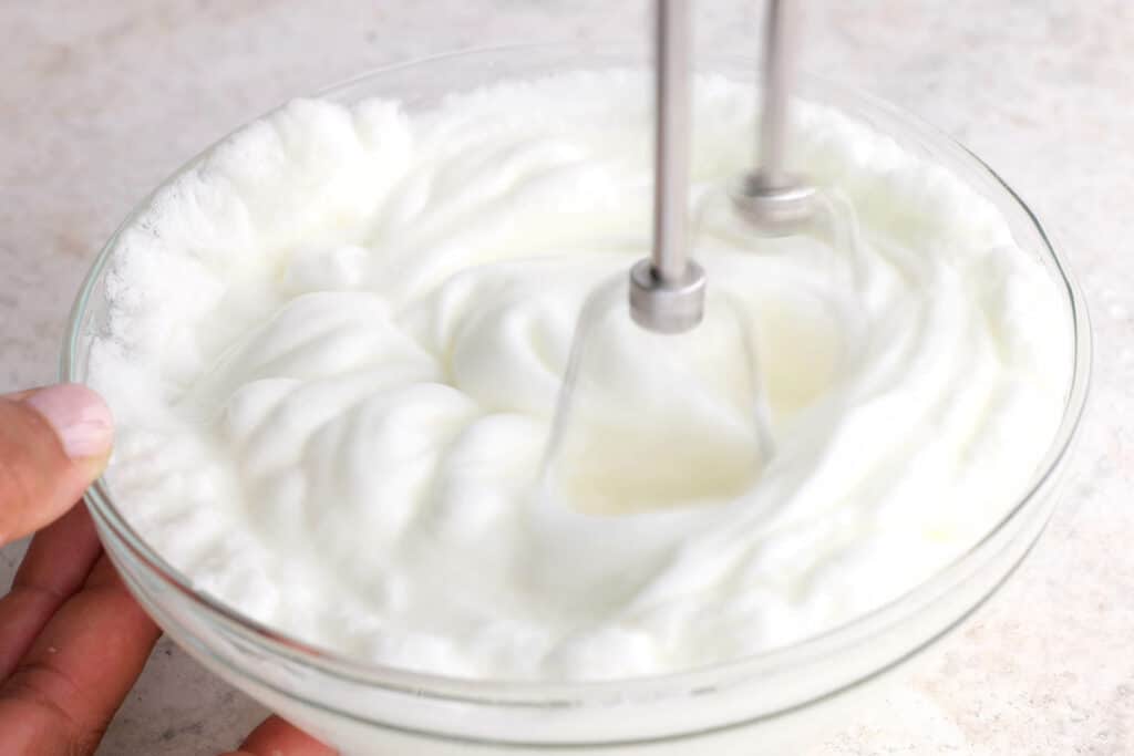 whip egg whites until stiff peaks form