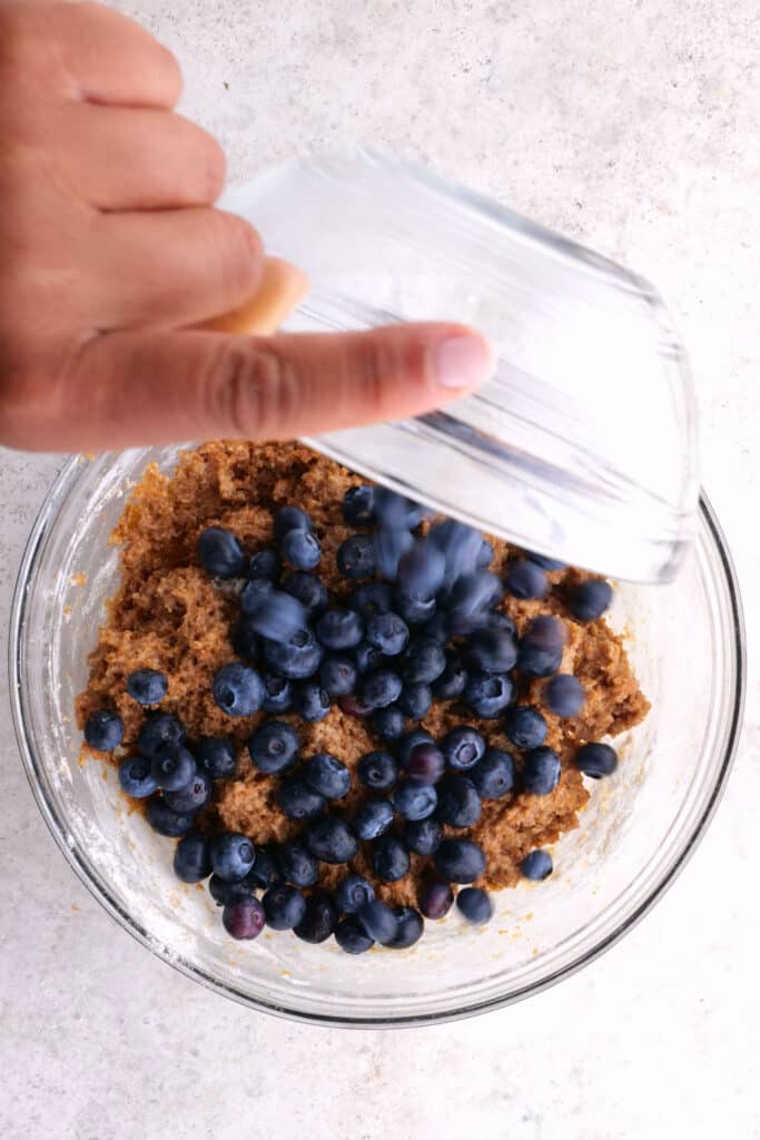 adding blueberries to the bran mixture