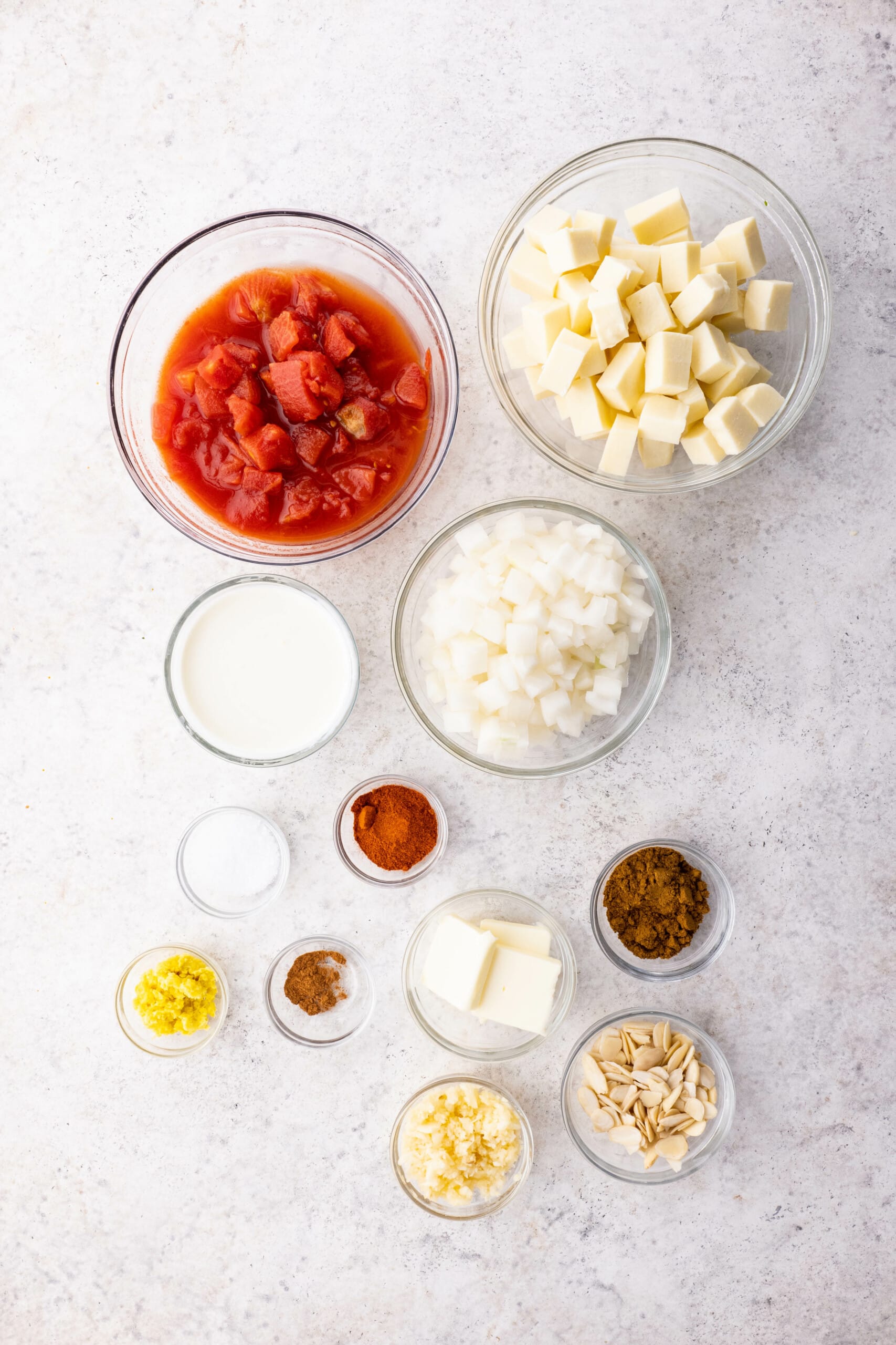Ingredients on a countertop for the Paneer Butter Masala.