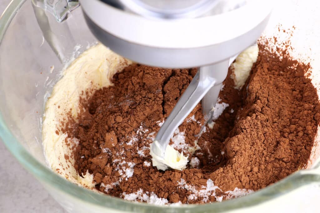 Combining dry ingredients for chocolate cake. 