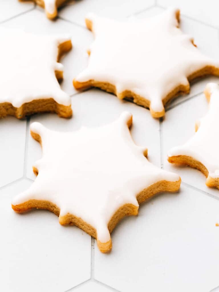 Snowflake cookies decorated simply with royal icing.