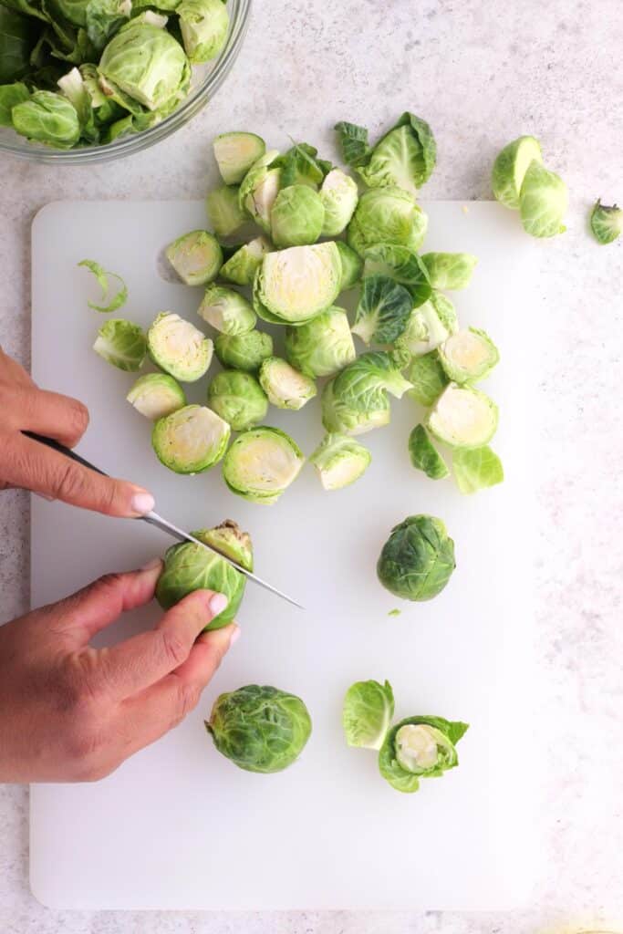 Chopping the brussel sprouts.