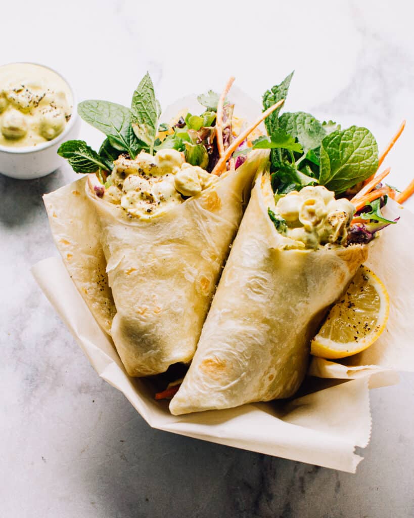 Indian Chickpea Salad in a wrap with fresh vegetables and herbs.