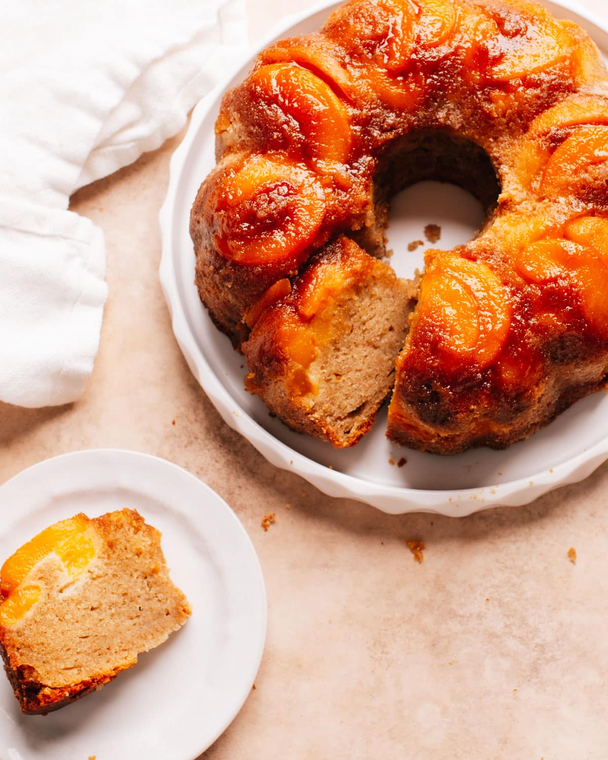 Peach Cobbler Pound Cake with a slice removed to a plate.