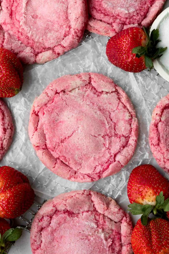 strawberry sugar cookies surrounded by fresh strawberries 