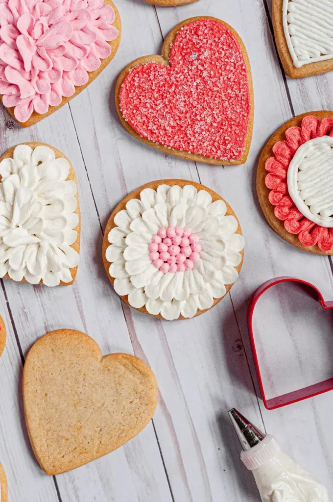 decorated honey sugar cookies with cookie cutter and piping bag