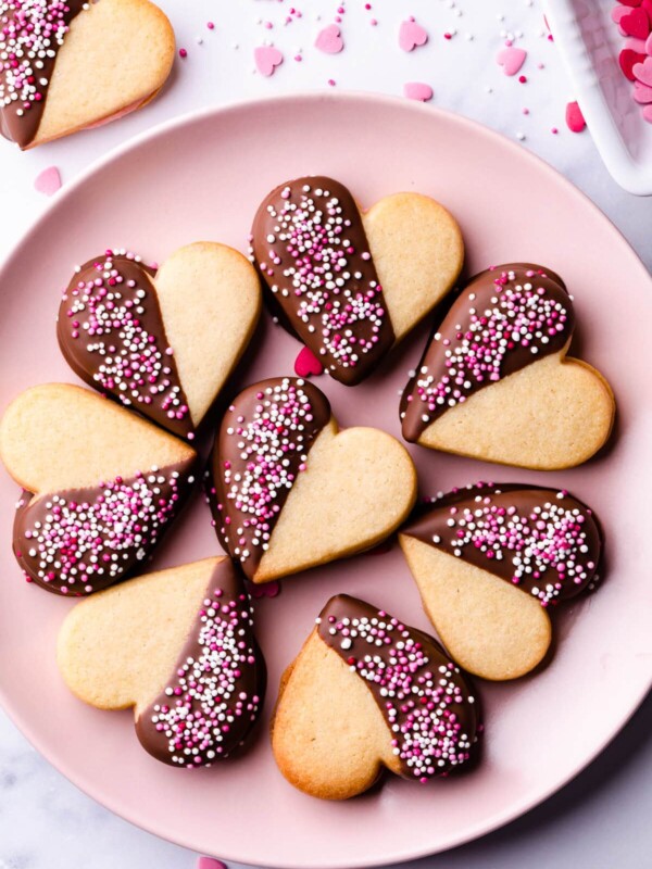Valentine's sugar cookies on a pink plate.