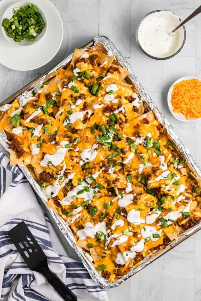 top-down view of chili nachos in a sheet pan