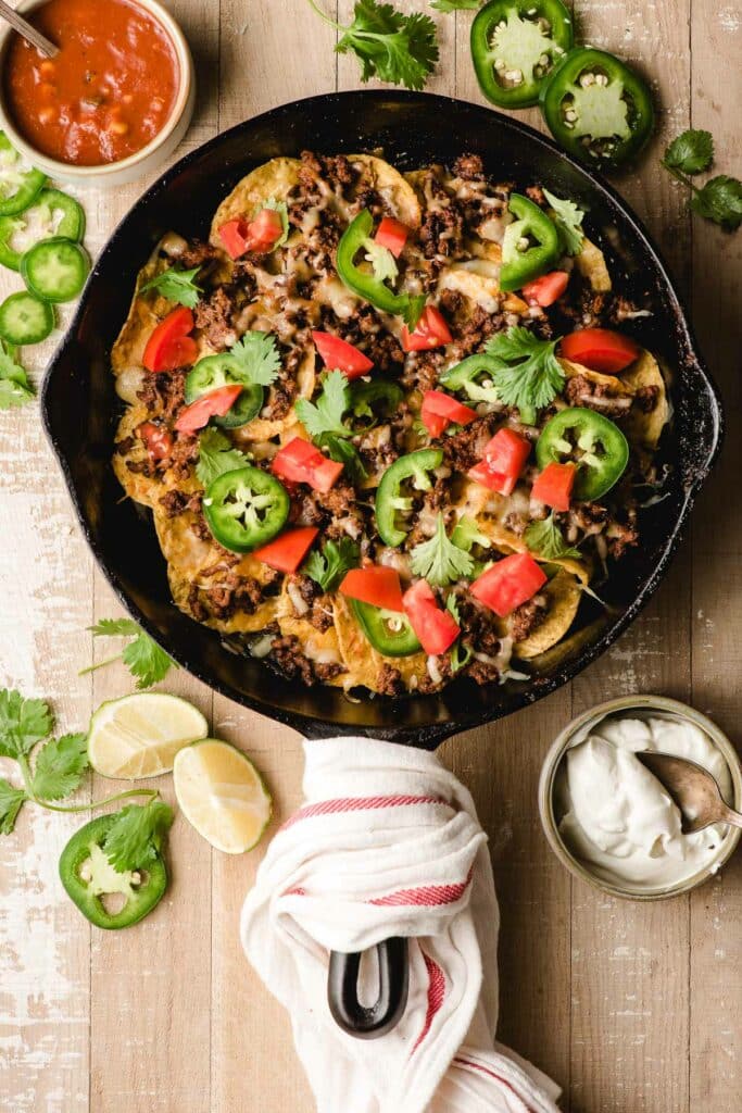 Ground Beef Nachos in a Sizzling Cast Iron Skillet, Served with a Dip on the Side