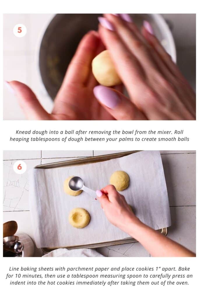 Cookie dough is shaped into balls and placed on a parchment-lined baking sheet. The cookies are baked in the oven for 10 minutes. After baking, a tablespoon measuring spoon is used to press an indent into the hot cookies.