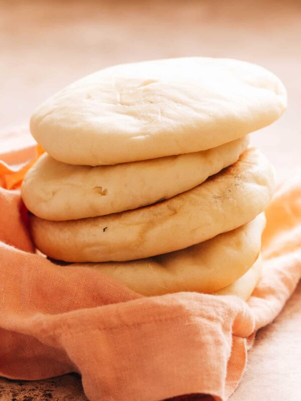 A stack of fresh turkish bread on a napkin.