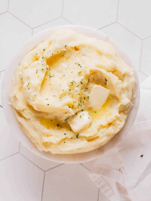 Mashed potatoes in a bowl with butter.