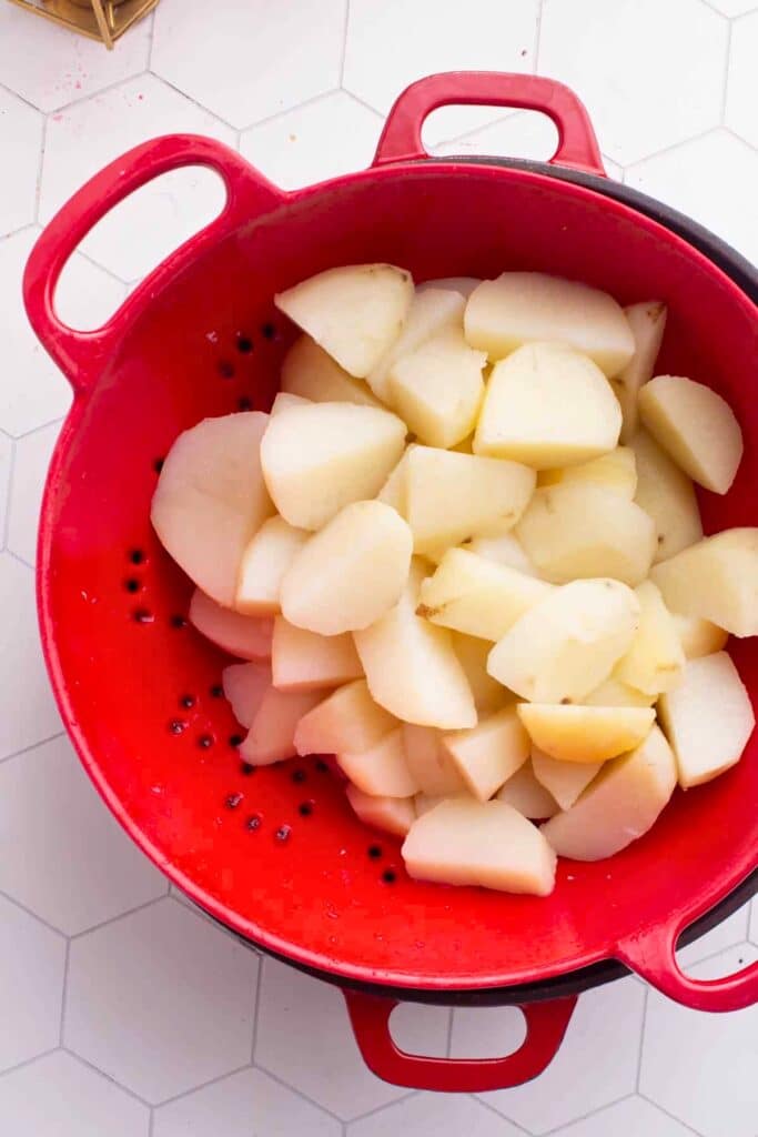 Boiled potatoes drained in a colander