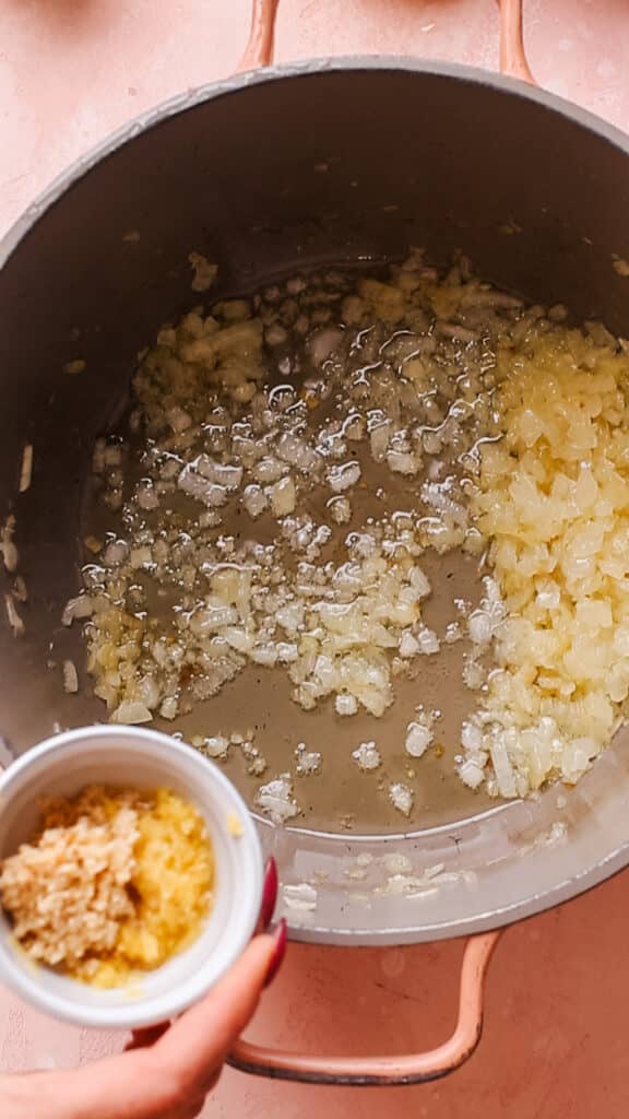 Cooking onions, garlic and ginger for malai kofta gravy.