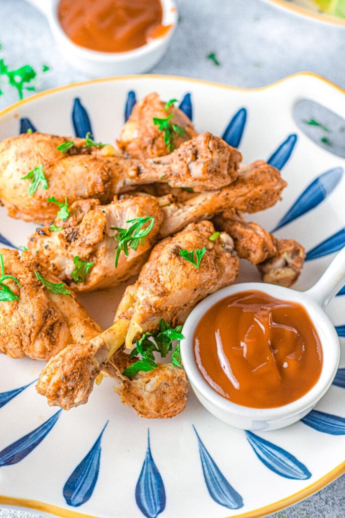 Instant Pot Chicken Drumsticks served with a dip