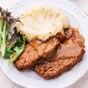 Meatloaf with Brown Gravy on a plate.