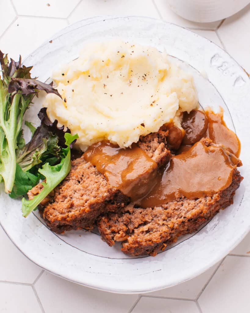 Meatloaf with Brown Gravy on a plate.