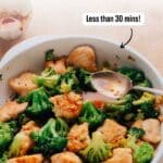 The chicken and broccoli stir fry is cooked in a large skillet.