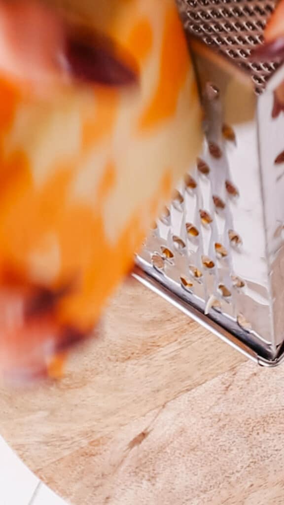 grating cheese for baked mac and cheese.