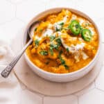 Coconut Curry Chicken in bowl with spoon