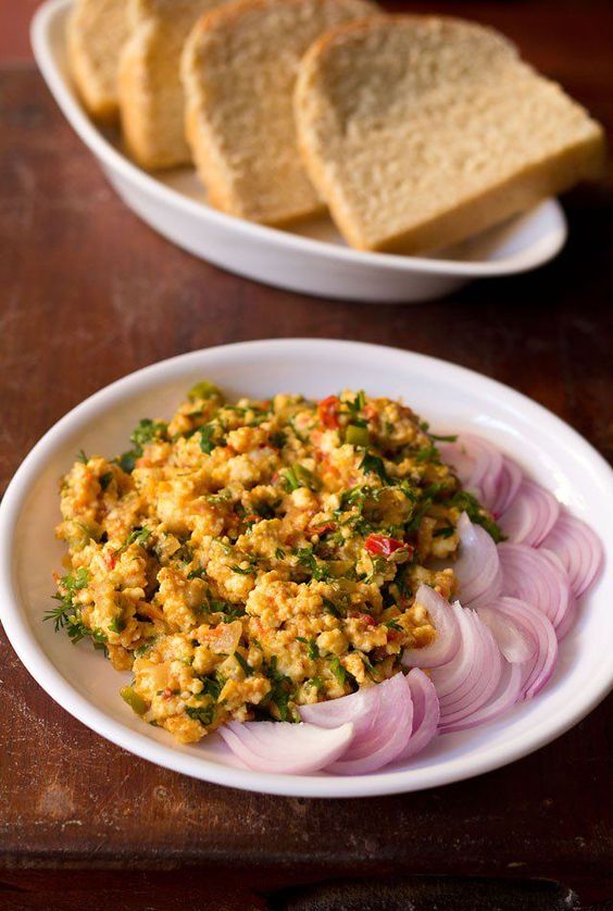 Paneer Bhurji in plate with onion slices