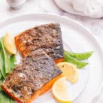 Salmon with lemon slice in plate