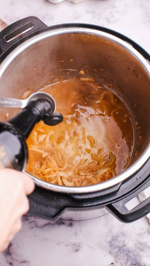 adding sauce in pot