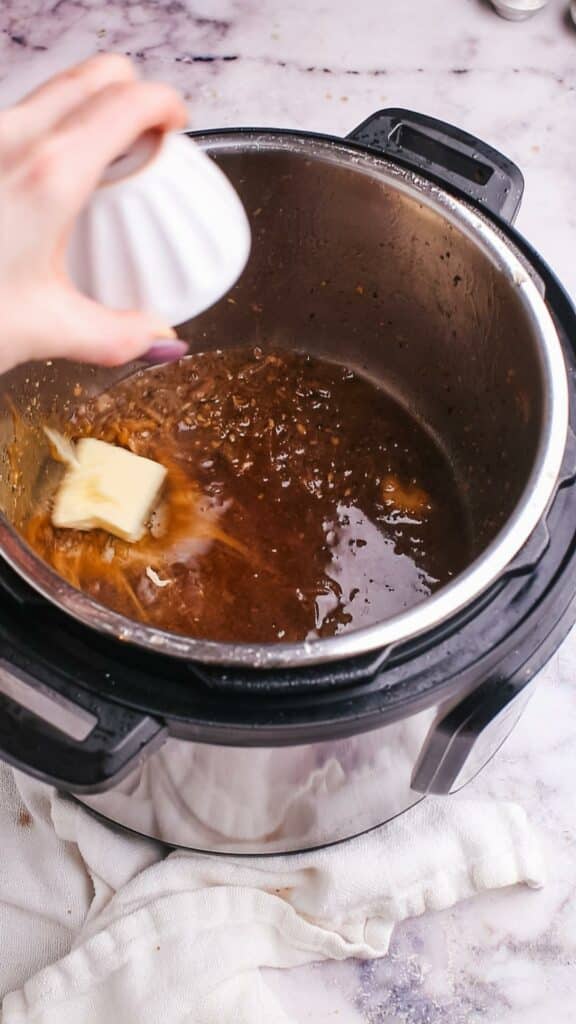 Adding butter to sauce