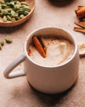 Chai coffee with cinnamon stick in cup