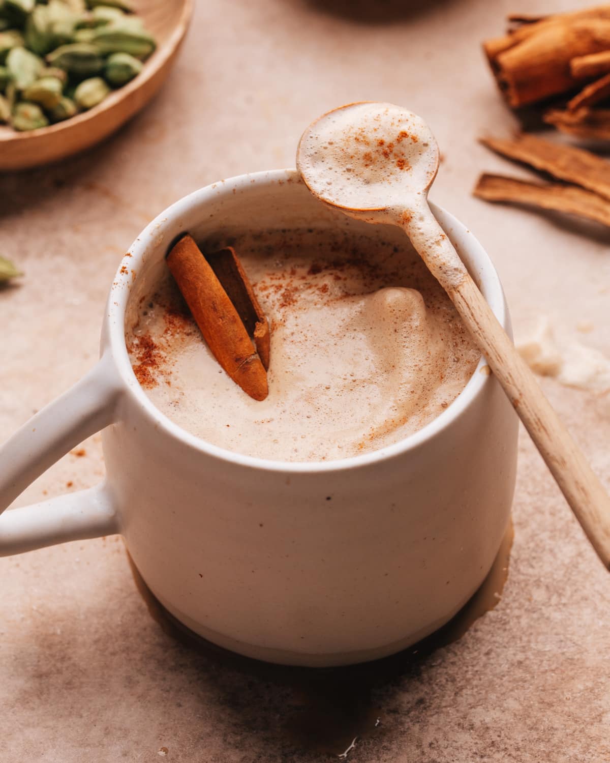Chai coffee recipe with a spoon. 