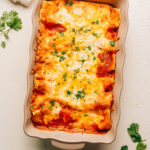 Cream Cheese Chicken Enchiladas in a baking dish.
