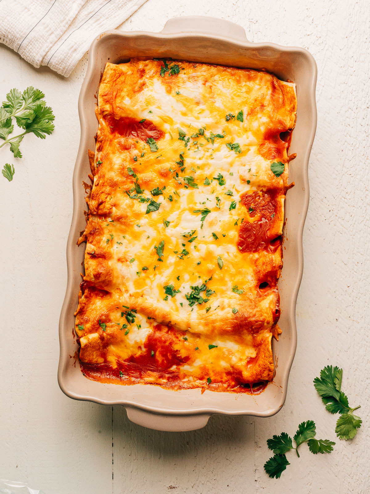 Cream Cheese Chicken Enchiladas in a baking dish.