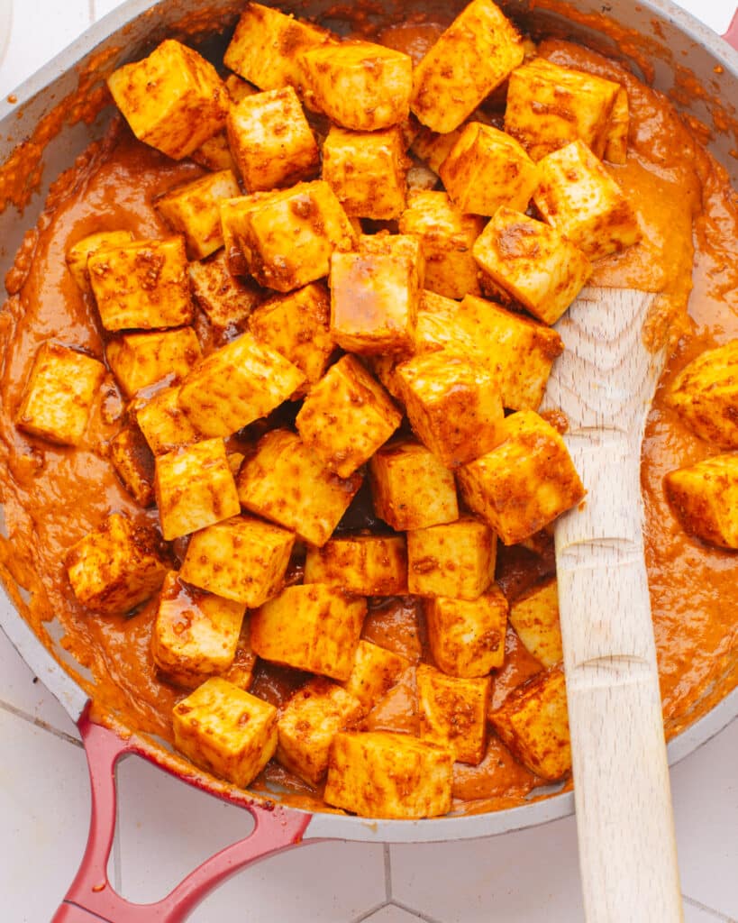 How to Make Paneer at Home photo of paneer in a pan with sauce.
